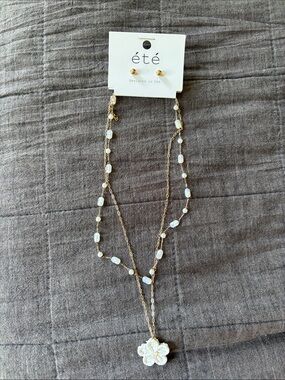 ETE Gold Layered Necklace with White Bead Accents and Floral Pendant